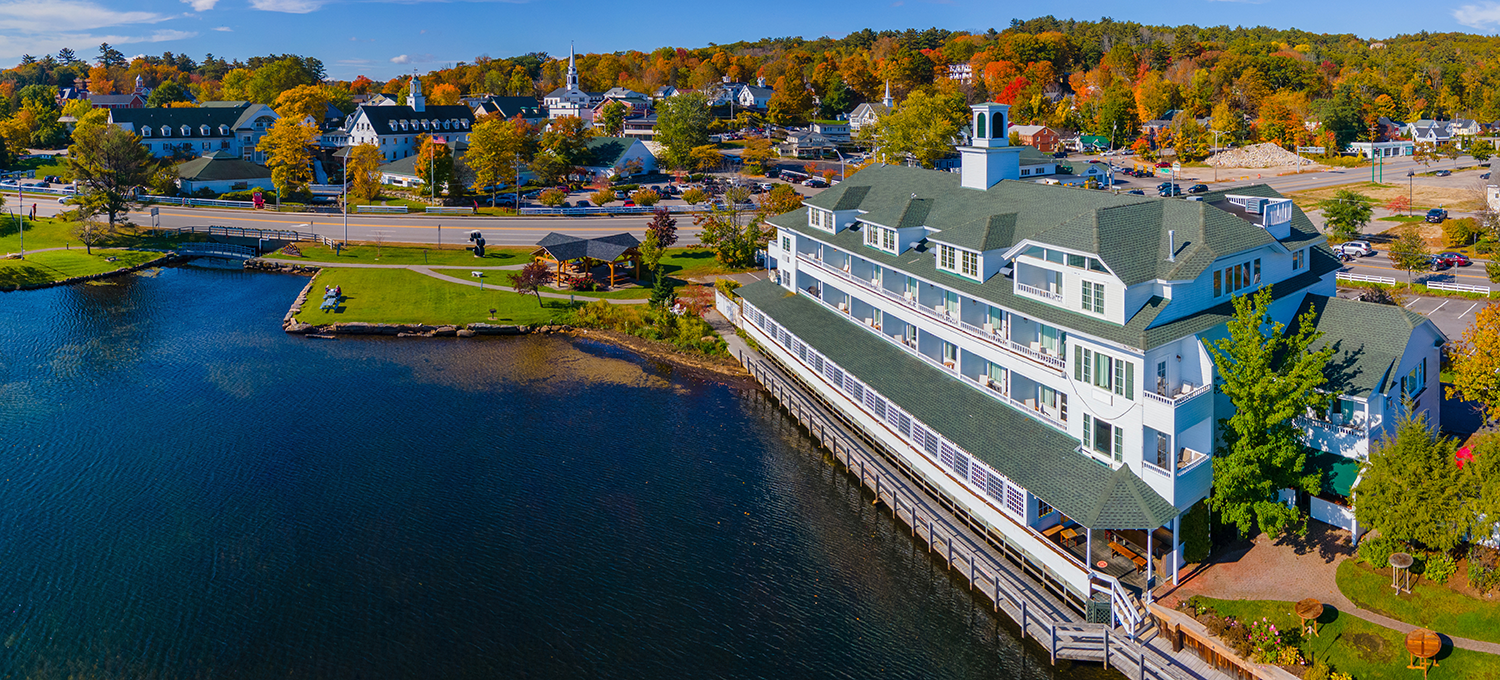 Bay point at Mill Falls with fall foliage panoramic aerial view with Meredith Bay in Lake Winnipesaukee in town of Meredith, New Hampshire NH, USA.